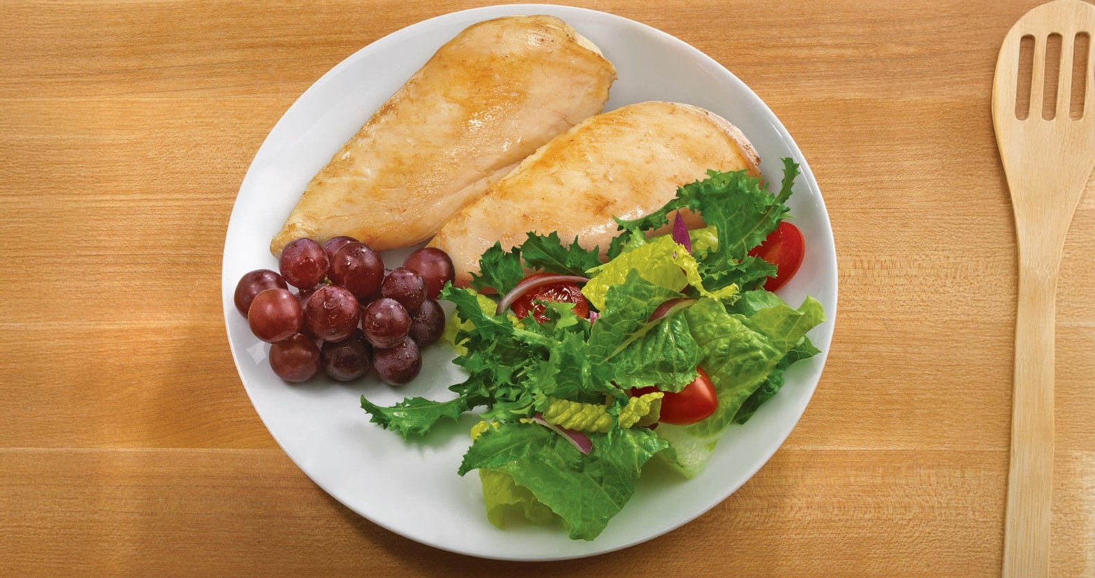 Tyson met lovers bowl with cut piece of bread on a cutting board