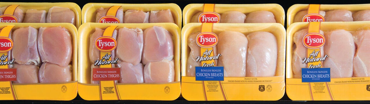 Tyson raw chicken breast and chicken thighs in packaging 
