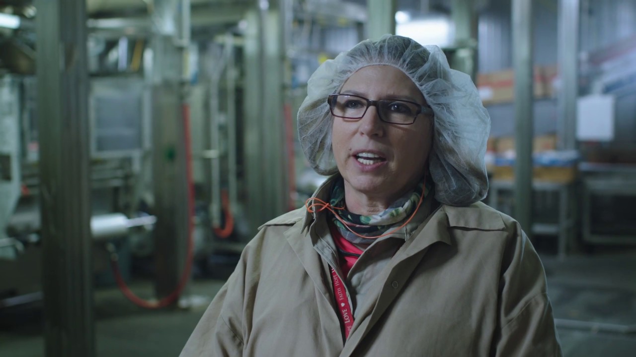 Woman with a hair net in a Tyson facility